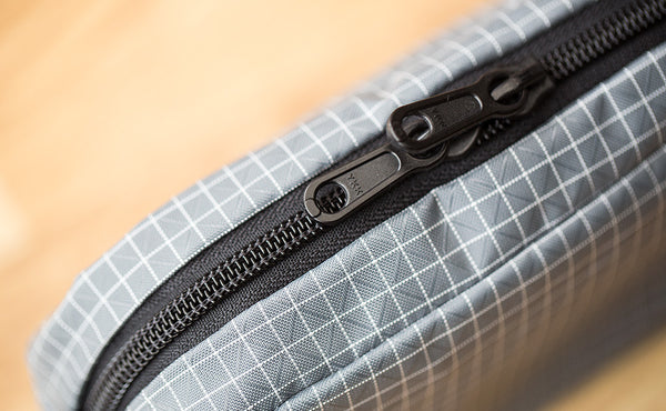 A close-up shot of the zipper on the 3D Organizer Cube.